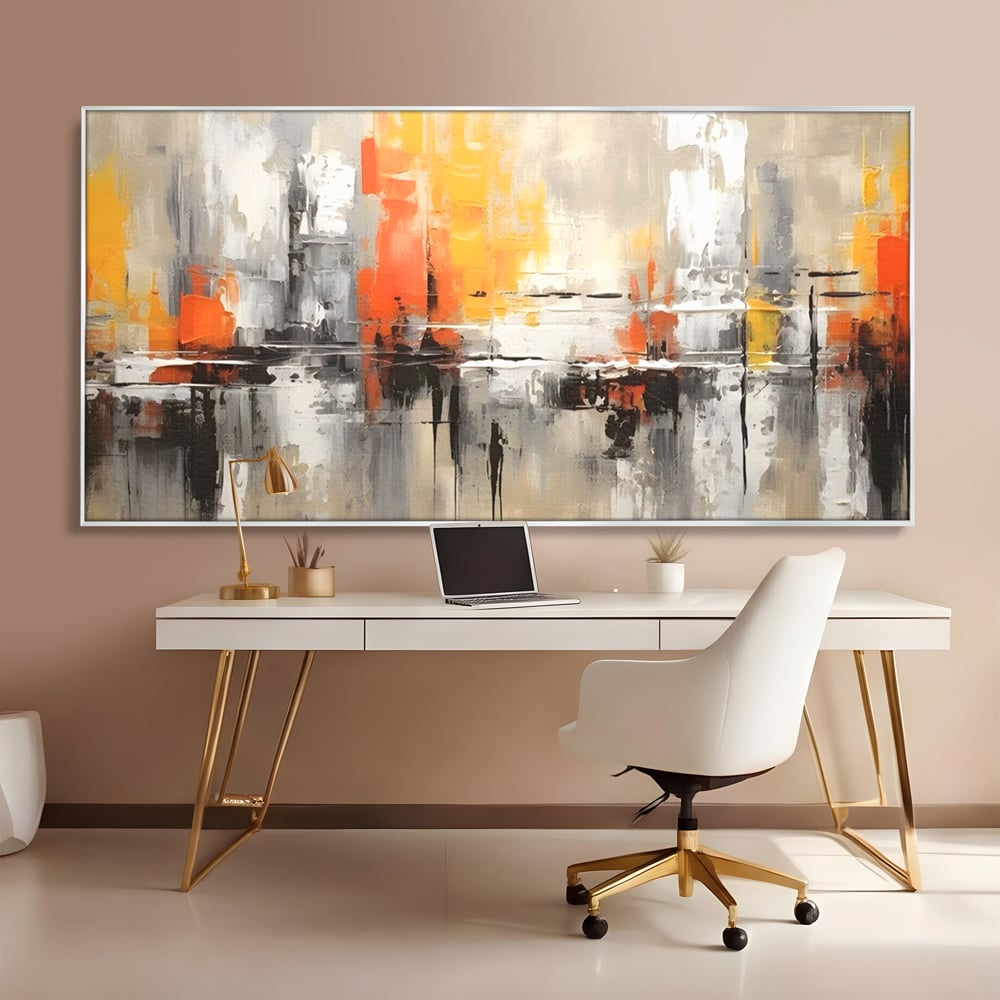 Tablou canvas cu pictura abstracta cu turnuri portocalii, in rama de aluminiu argintiu, pe perete intr-un birou